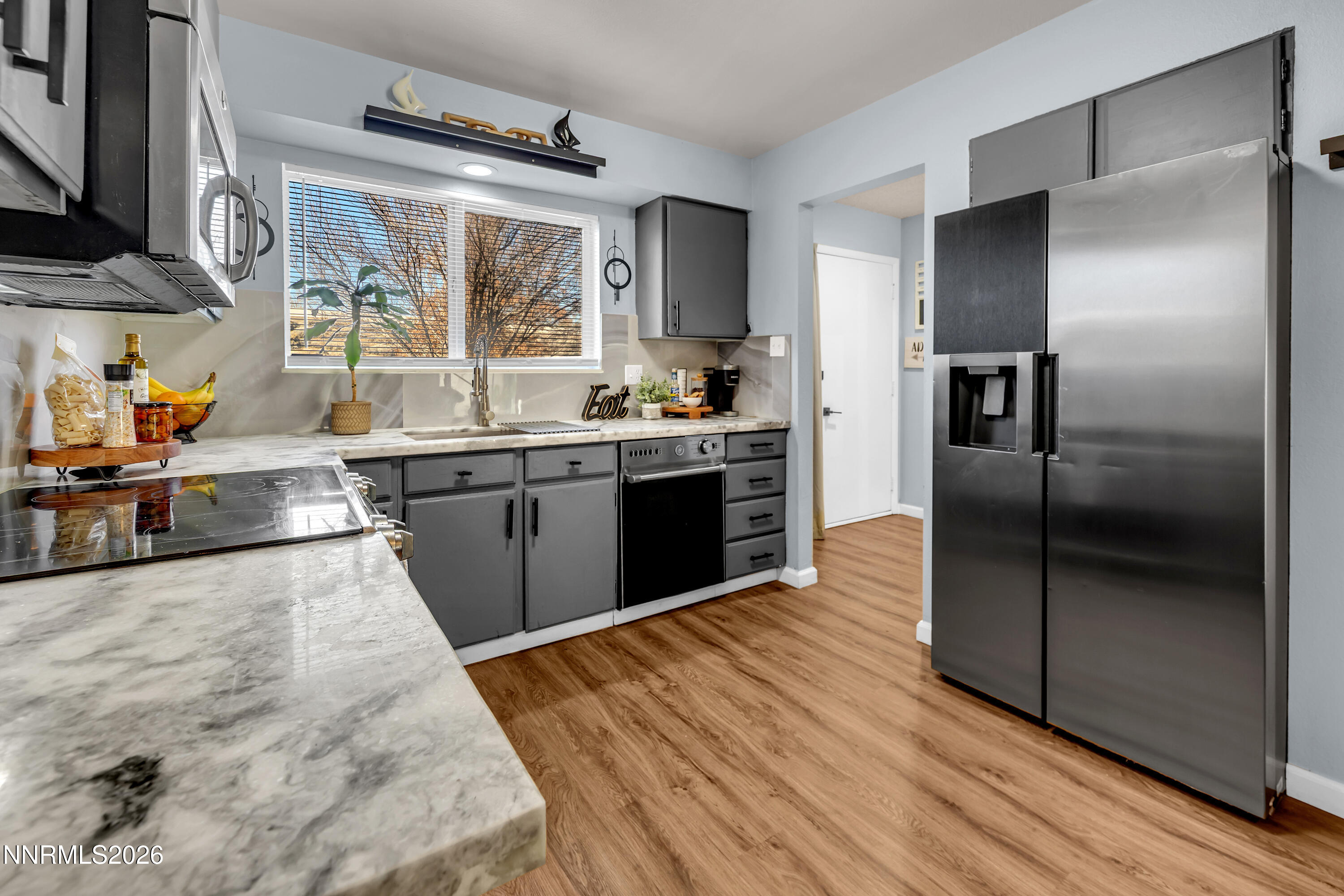 562 Smithridge Park Reno, NV 89502 - Photo 6 of 43 a large kitchen with stainless steel appliances granite countertop a refrigerator and a sink