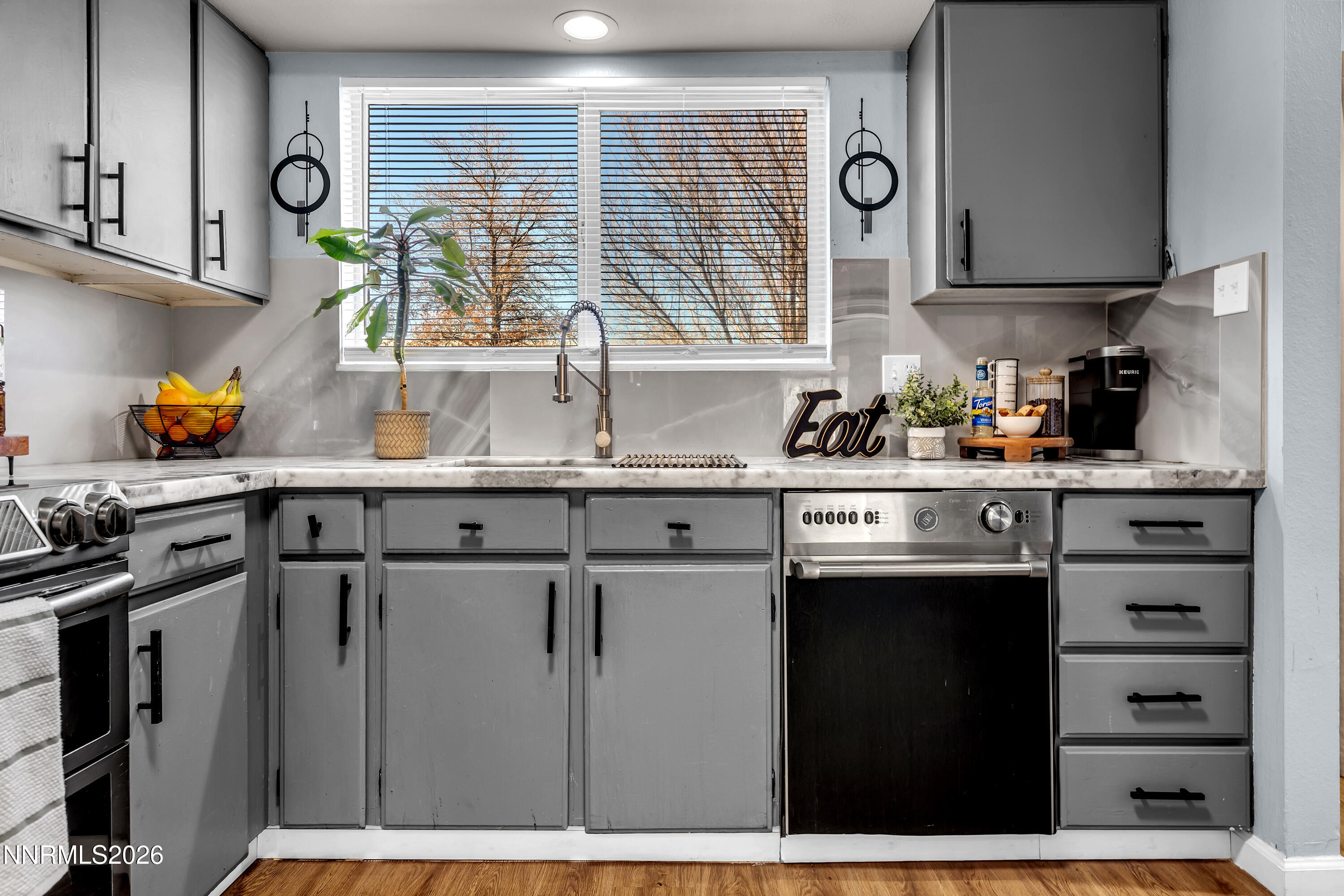 562 Smithridge Park Reno, NV 89502 - Photo 10 of 43 a kitchen with stainless steel appliances a sink stove and cabinets