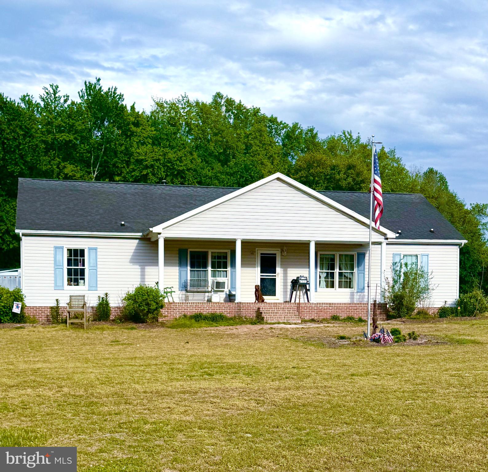 6401 Laurel Grove Road Denton, MD 21629 - Photo 1 of 20 a front view of a house with swimming pool having outdoor seating