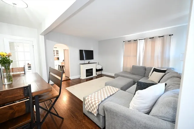 a living room with furniture fireplace and a flat screen tv