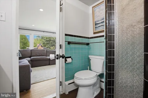 a bathroom with a toilet and a sink