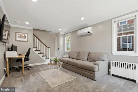 a living room with furniture and a window