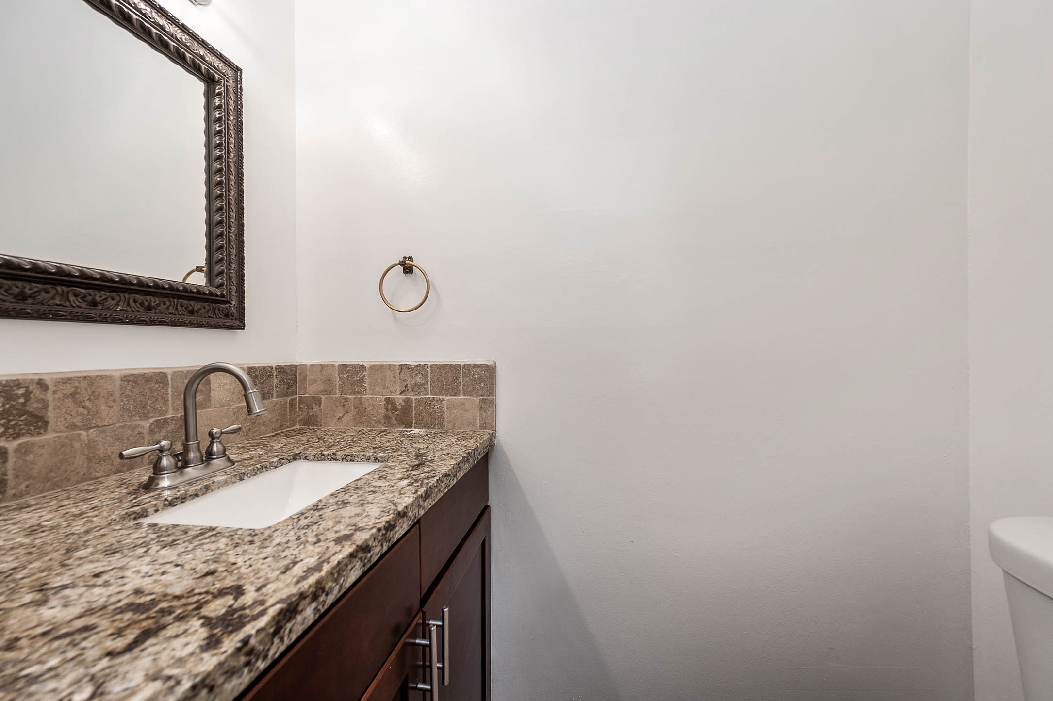 6000 Reims Road, Unit 2003 Houston, TX 77036 - Photo 11 of 24 a bathroom with a granite countertop sink and a mirror