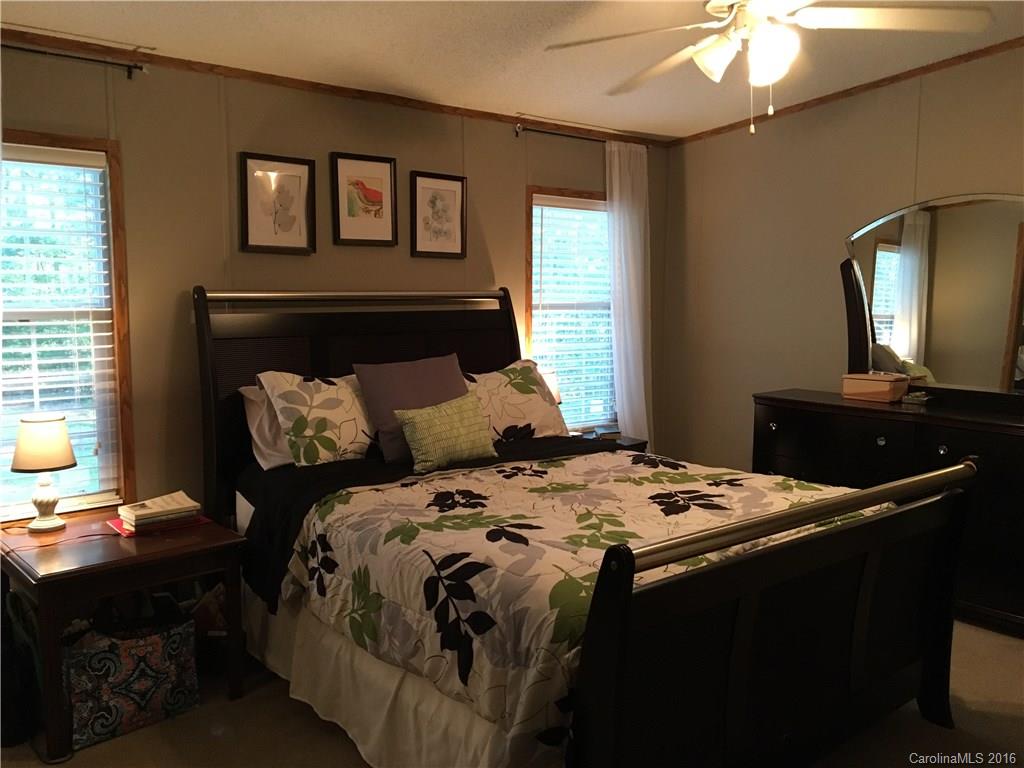 5125 Cabal Road Sharon, SC 29742 - Photo 14 of 21 a bedroom with a bed and a mirror on the dresser