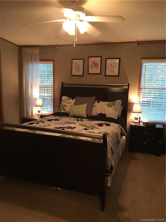 5125 Cabal Road Sharon, SC 29742 - Photo 15 of 21 a bed sitting in a bedroom next to a window