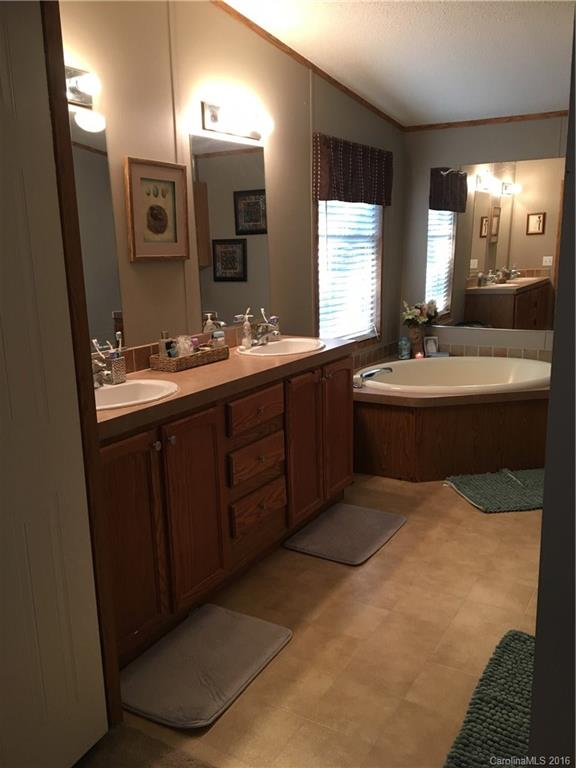 5125 Cabal Road Sharon, SC 29742 - Photo 16 of 21 a bathroom with a tub sink and mirror