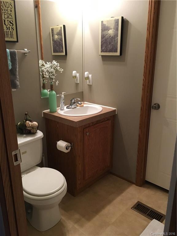 5125 Cabal Road Sharon, SC 29742 - Photo 20 of 21 a bathroom with a toilet a sink and mirror
