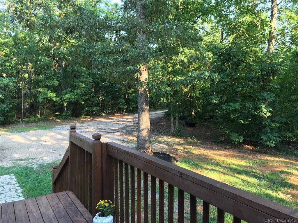 5125 Cabal Road Sharon, SC 29742 - Photo 9 of 21 a view of a wooden deck and a yard with wooden fence