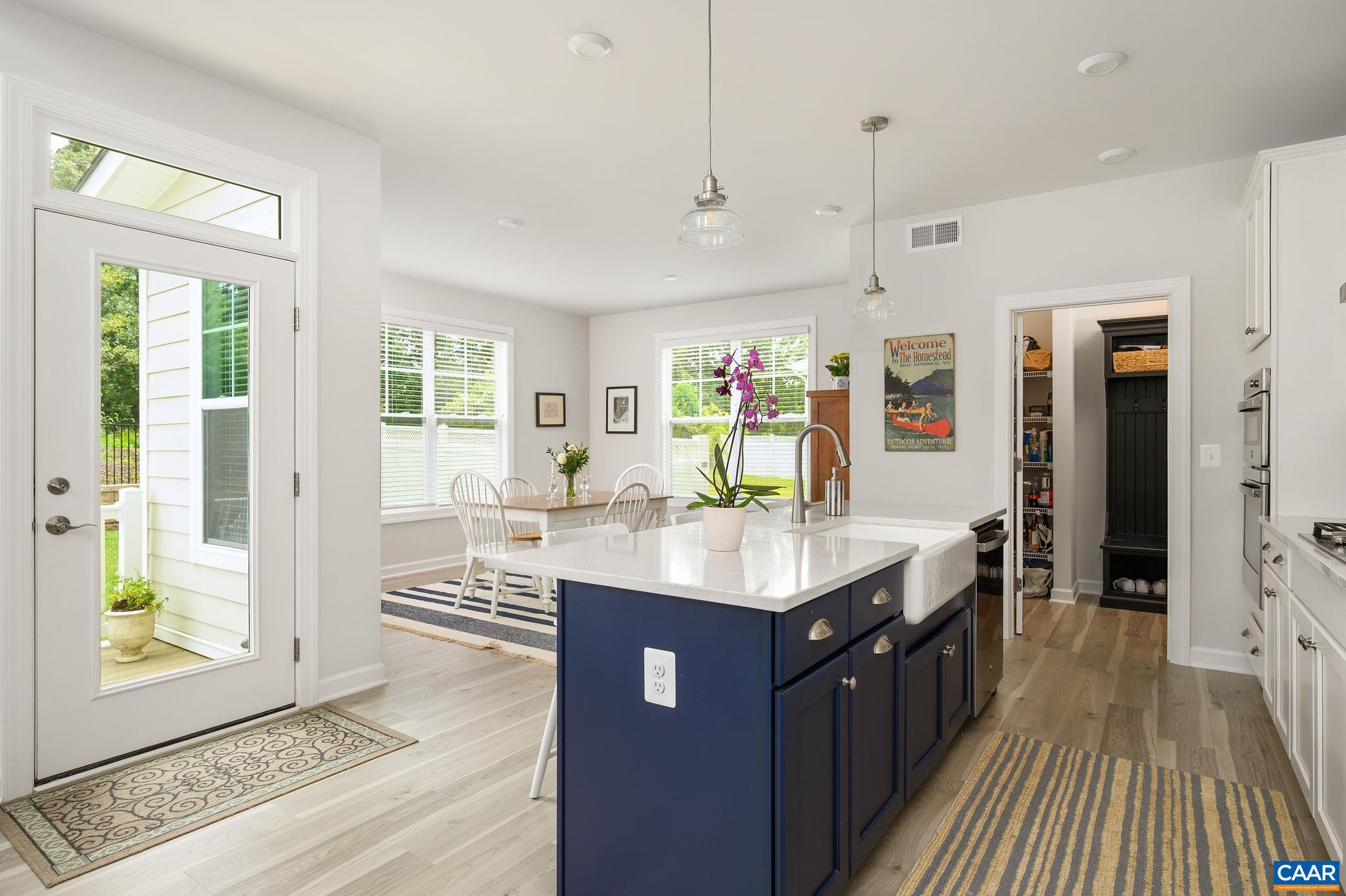 3526 Thicket Run Place Charlottesville, VA 22911 - Photo 13 of 36 a kitchen with stainless steel appliances granite countertop a sink stove and a wooden floors