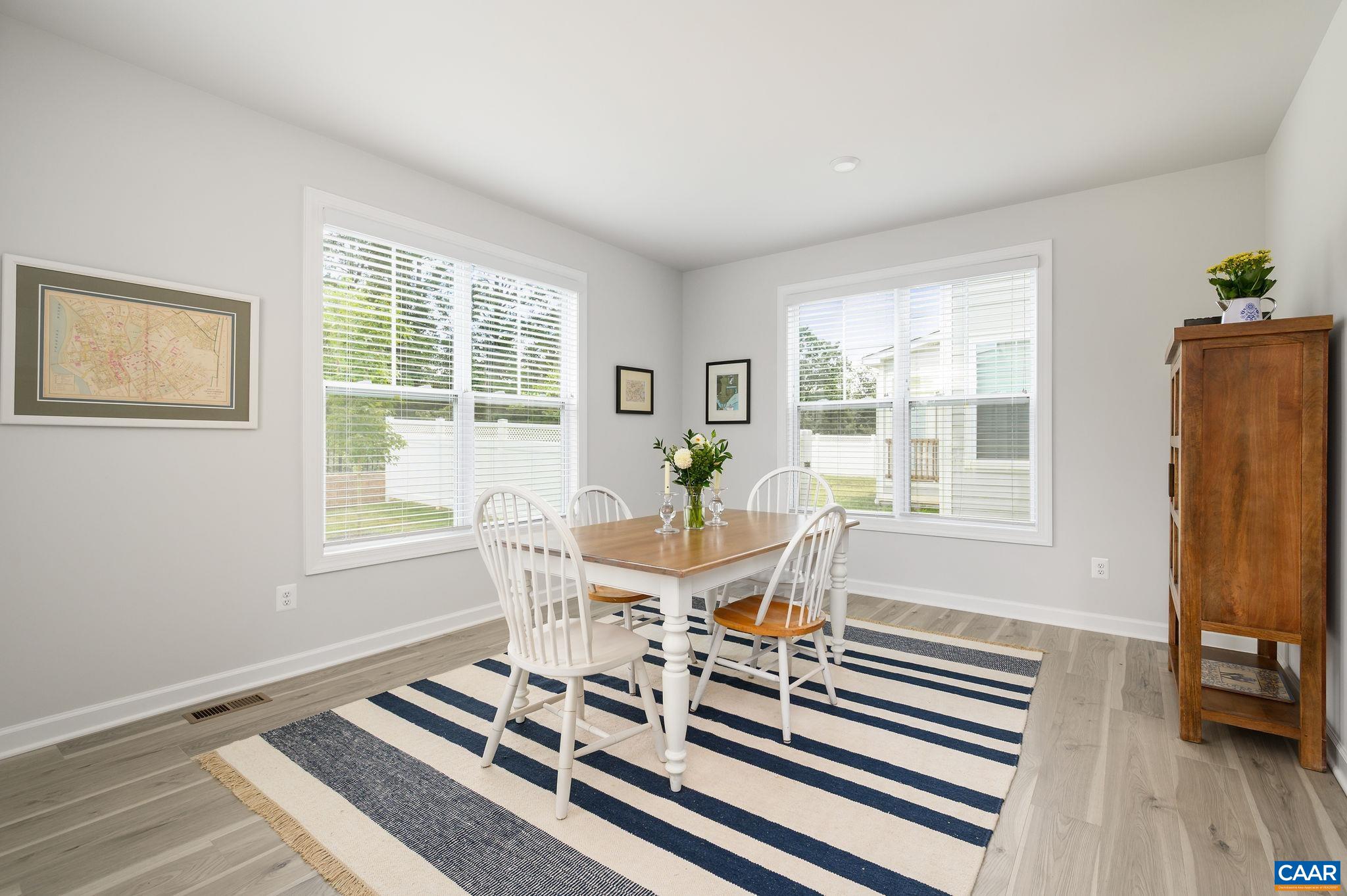3526 Thicket Run Place Charlottesville, VA 22911 - Photo 16 of 36 a dining room with furniture and wooden floor