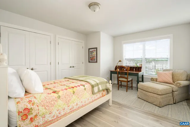 a bedroom with a bed and a couch