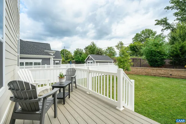 a view of a deck with two chair and table