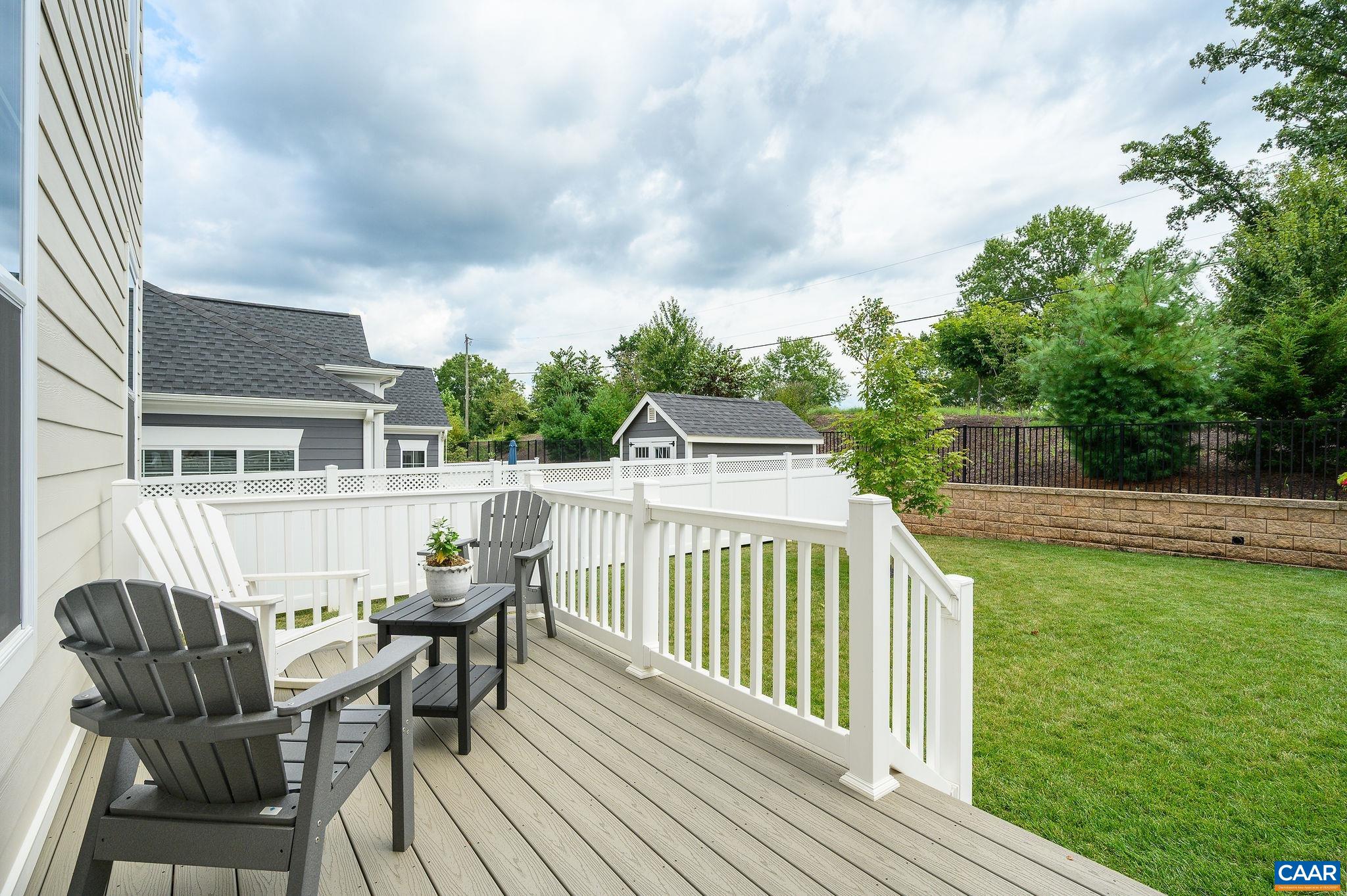 3526 Thicket Run Place Charlottesville, VA 22911 - Photo 26 of 36 a view of a deck with two chair and table