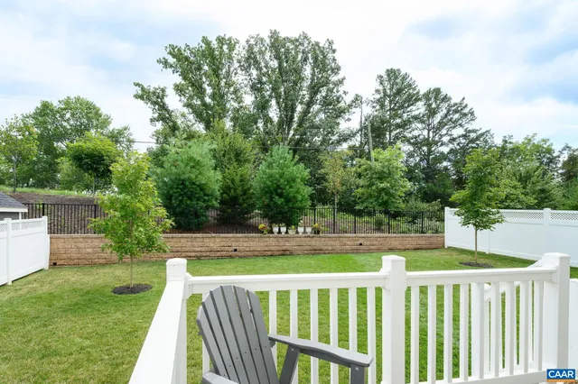 a view of yard with green space and deck