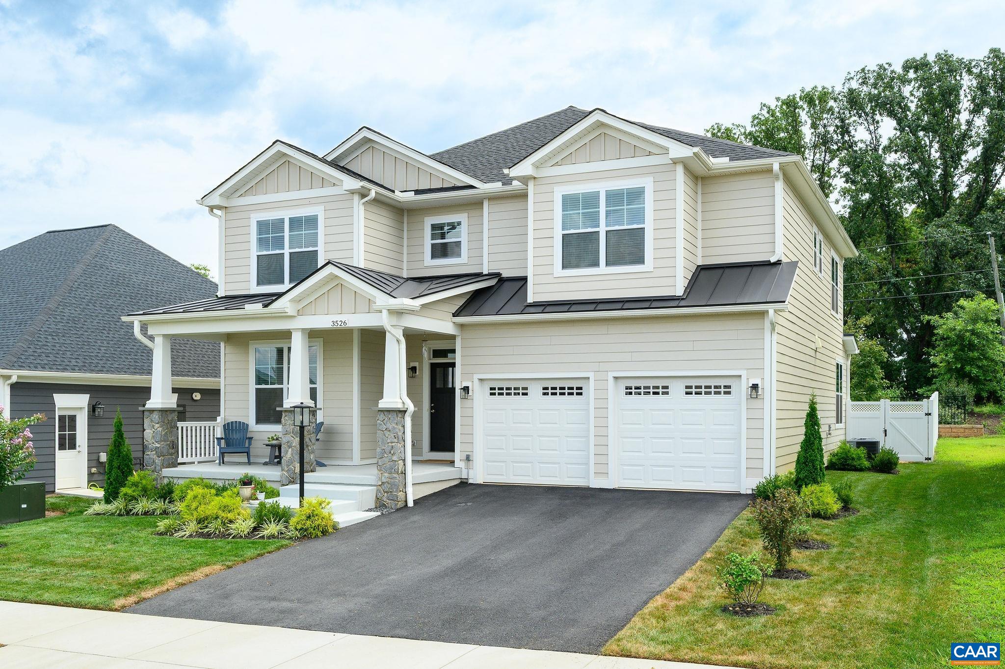3526 Thicket Run Place Charlottesville, VA 22911 - Photo 3 of 36 a front view of a house with a garden and plants