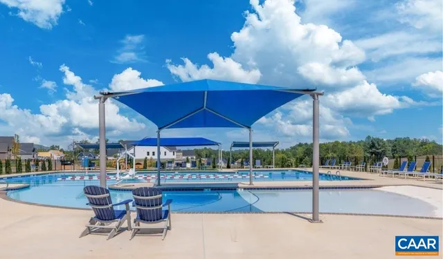 a view of a patio with a table and chairs