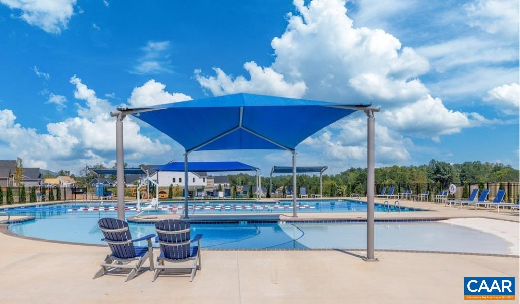3526 Thicket Run Place Charlottesville, VA 22911 - Photo 33 of 36 a view of a patio with a table and chairs