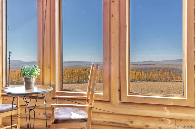a bedroom with a bed next to a window