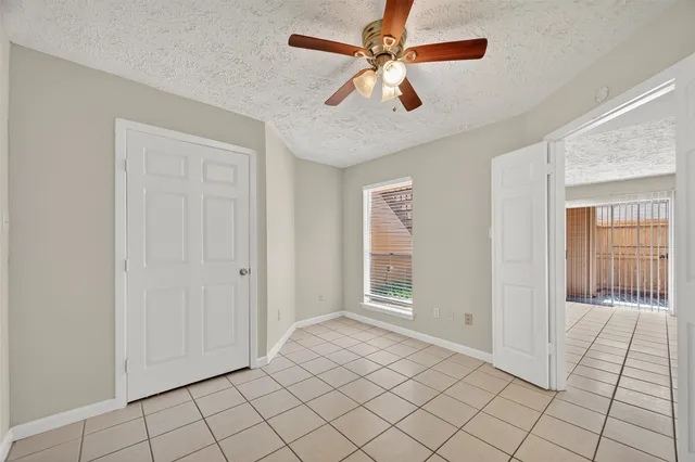 a bathroom with a bathtub shower sink vanity and toilet