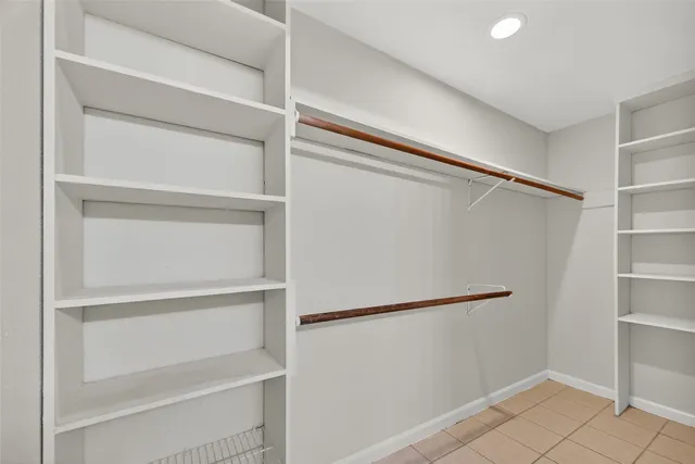 a view of a porch with wooden floor and fence