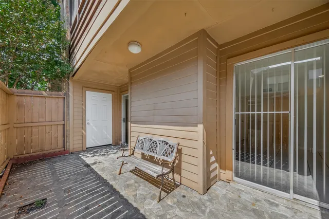 a view of a swimming pool with a yard in front of it