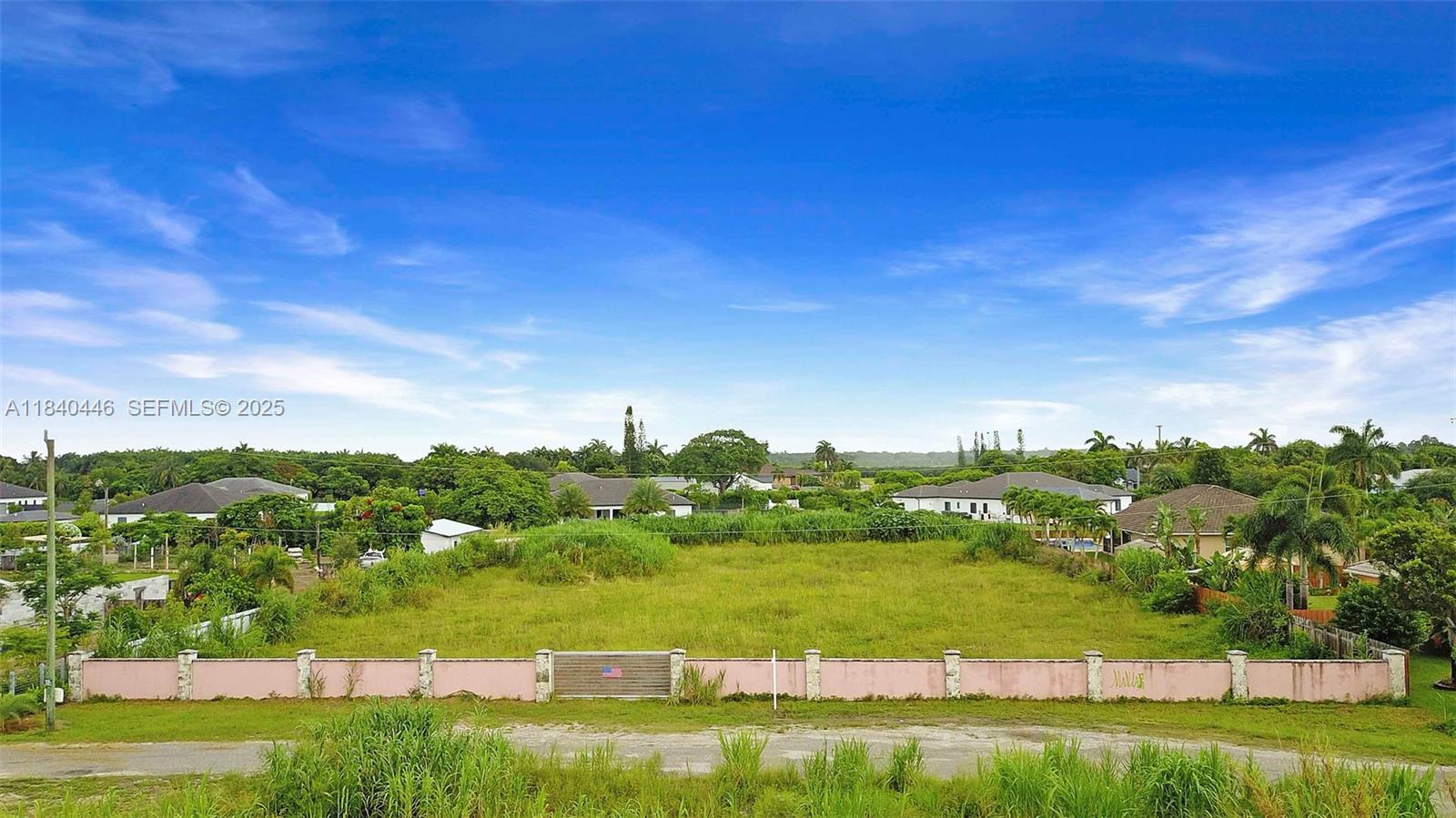 17399 Southwest 282nd Street Homestead, FL 33030 - Photo 1 of 6 a view of lake with houses