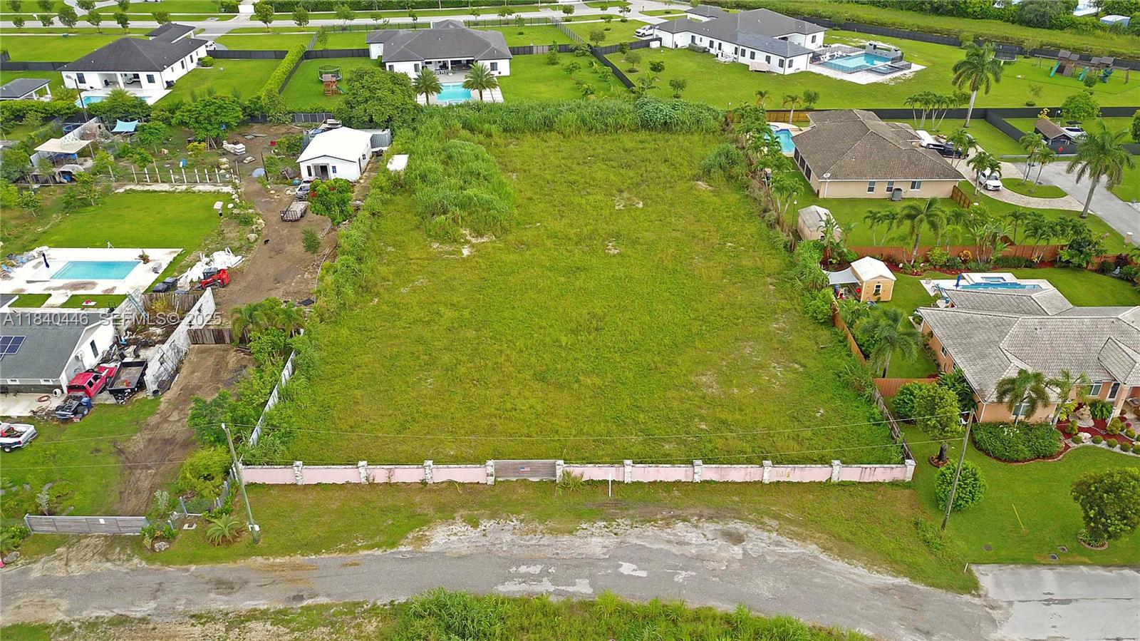 17399 Southwest 282nd Street Homestead, FL 33030 - Photo 2 of 6 an aerial view of a residential houses with outdoor space