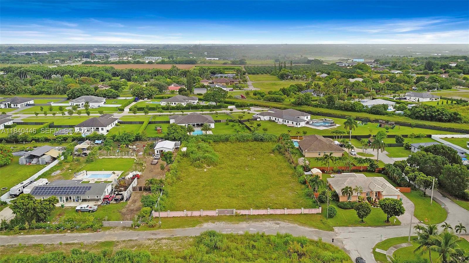 17399 Southwest 282nd Street Homestead, FL 33030 - Photo 3 of 6 an aerial view of residential houses with outdoor space and trees