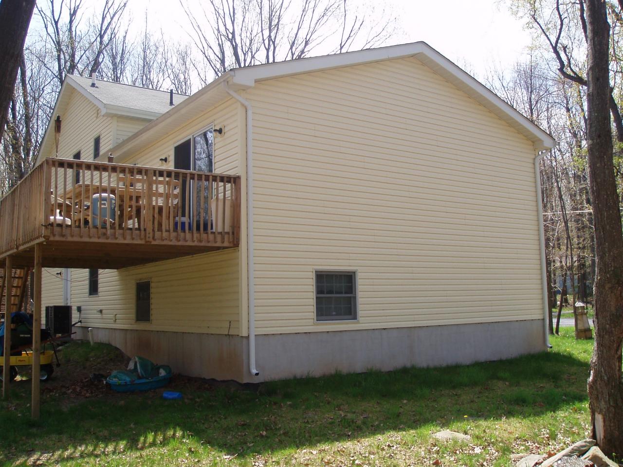 320 Deer Run Road Pocono Summit, PA 18346 - Photo 4 of 20 a view of a house with a yard
