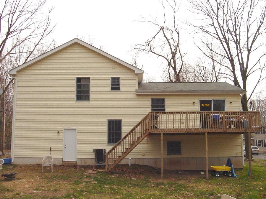 320 Deer Run Road Pocono Summit, PA 18346 - Photo 6 of 20 a house that has window in front of it