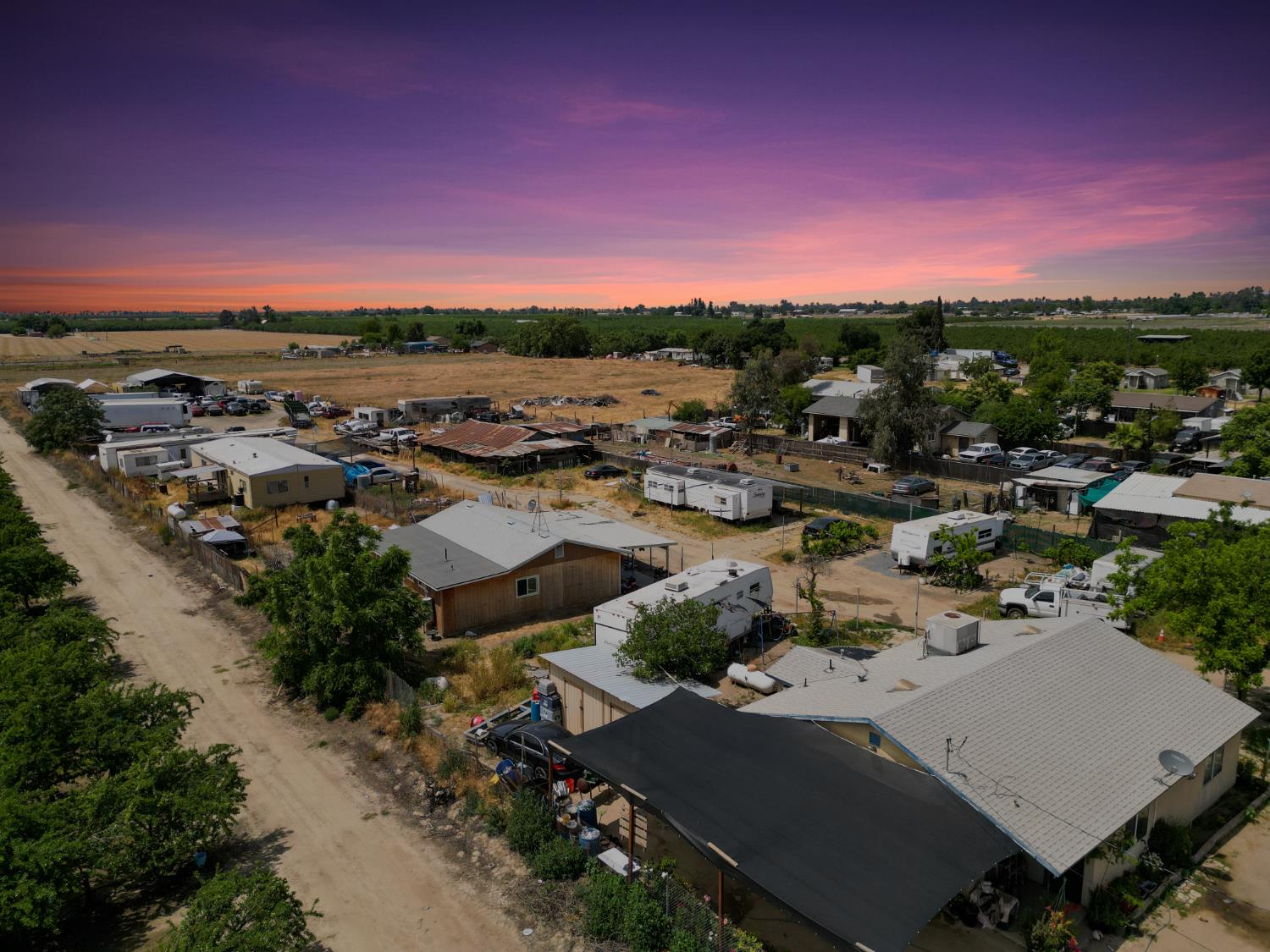 an aerial view of a house with a lot of trees