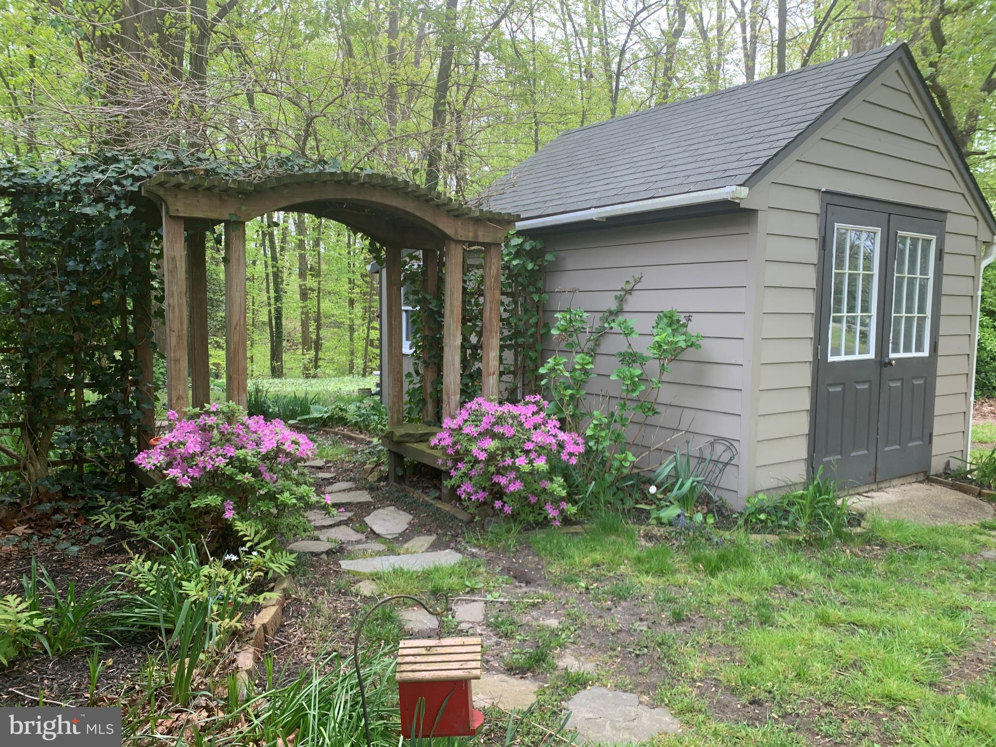 9490 Quail Run Road Denton, MD 21629 - Photo 34 of 35 Landscaping Arbor with Storage Shed