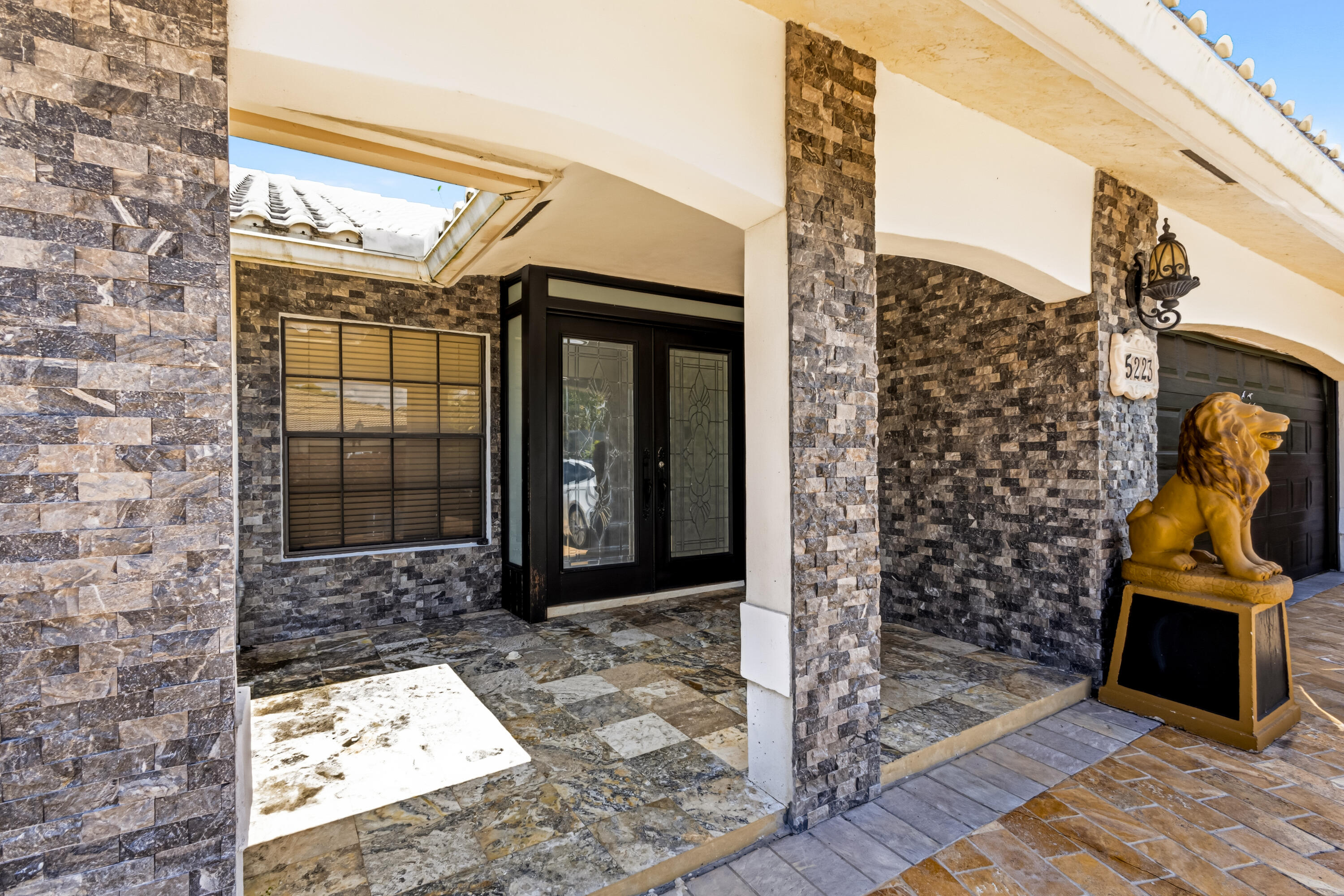 5223 Deerhurst Crescent Circle Boca Raton, FL 33486 - Photo 10 of 51 a view of a entryway door front of house
