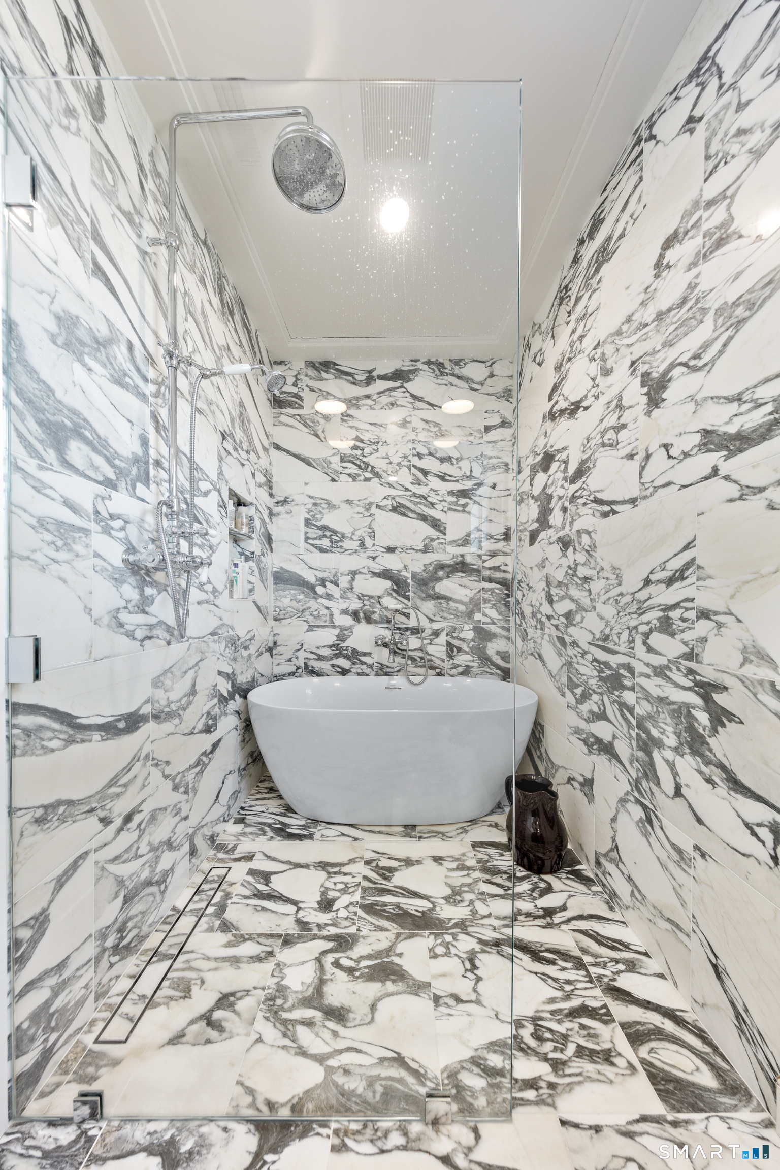 135 Old Dam Road Fairfield, CT 06824 - Photo 18 of 39 located on first level with walk in shower and soaking tub. All marble bath.