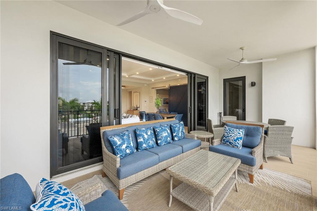 1135 3rd Avenue South, Unit 319 Naples, FL 34102 - Photo 14 of 19 a living room with furniture and a potted plant