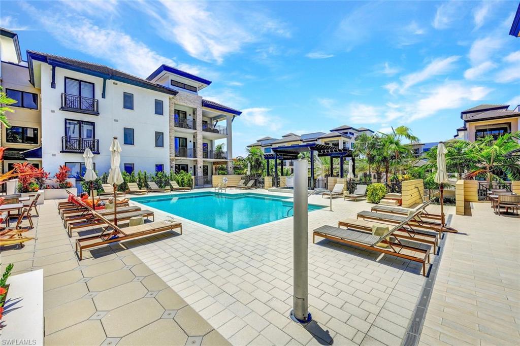 1135 3rd Avenue South, Unit 319 Naples, FL 34102 - Photo 16 of 19 a view of outdoor space yard swimming pool and patio