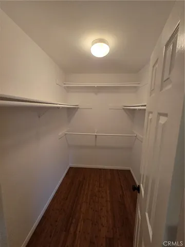 a view of storage and utility room with racks on the wall