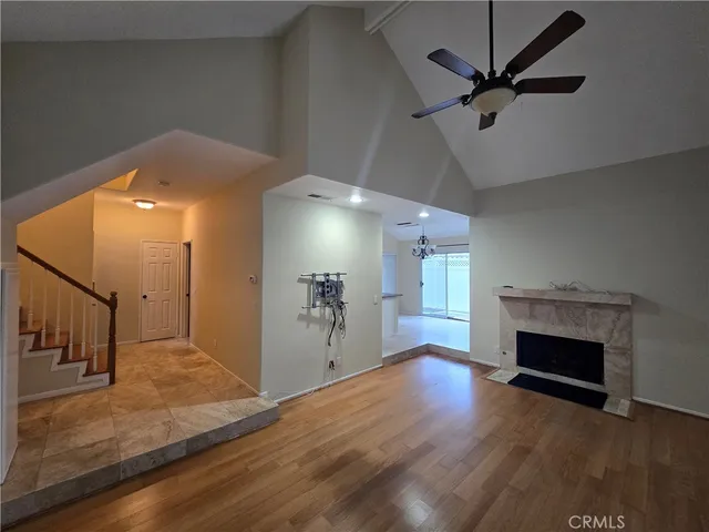 wooden floor in an empty room with a fireplace