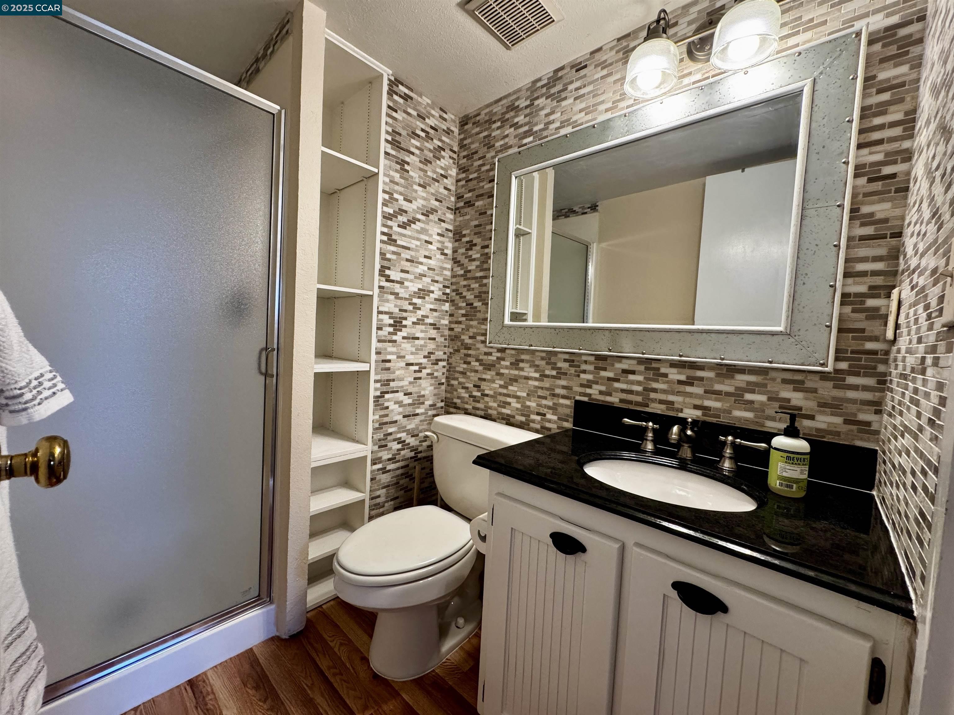 1640 San Miguel Drive Walnut Creek, CA 94596 - Photo 13 of 21 a bathroom with a toilet sink and mirror
