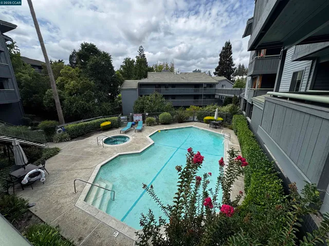 a view of a backyard with sitting area