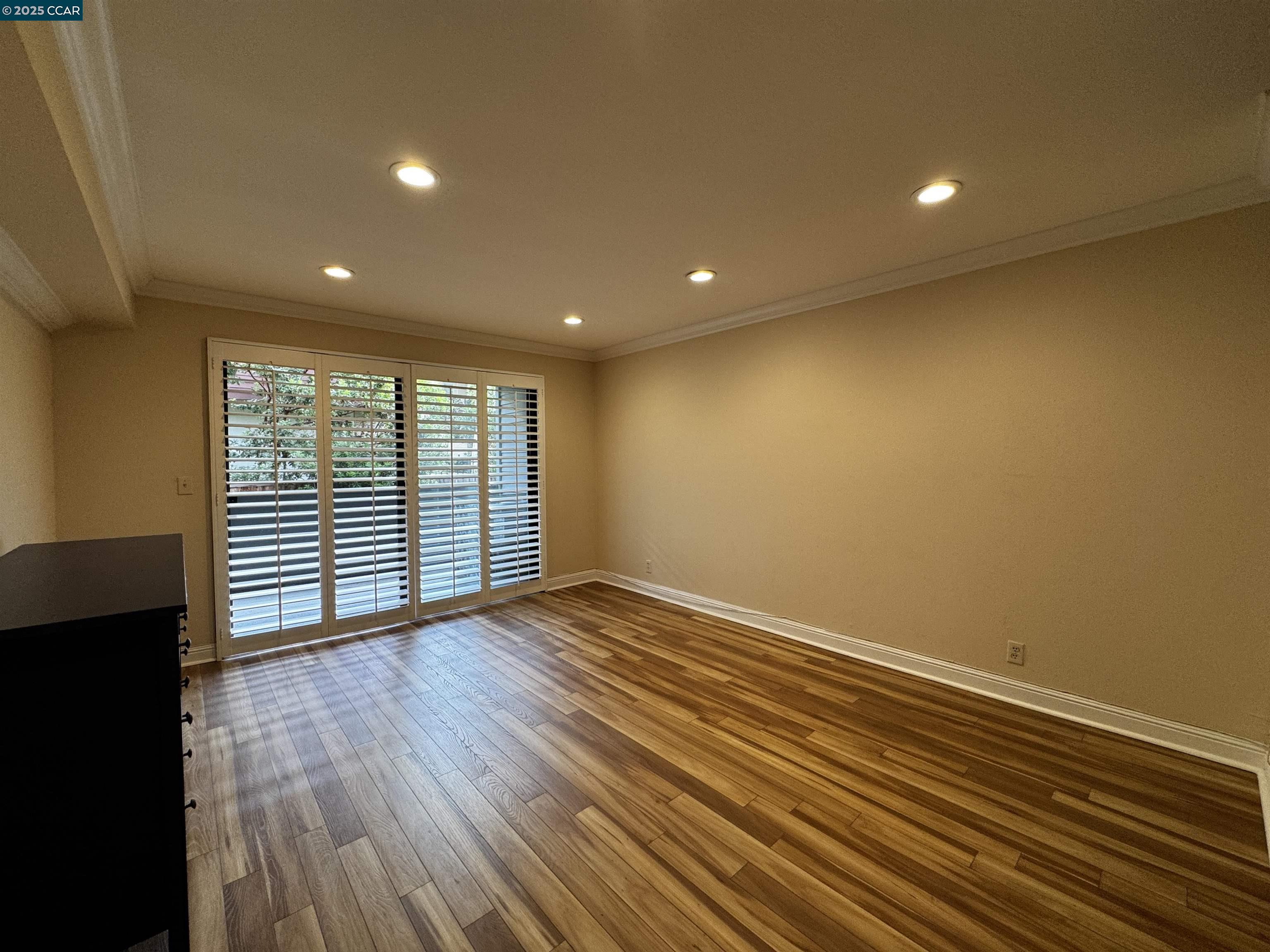 1640 San Miguel Drive Walnut Creek, CA 94596 - Photo 7 of 21 a view of an empty room with wooden floor and a window