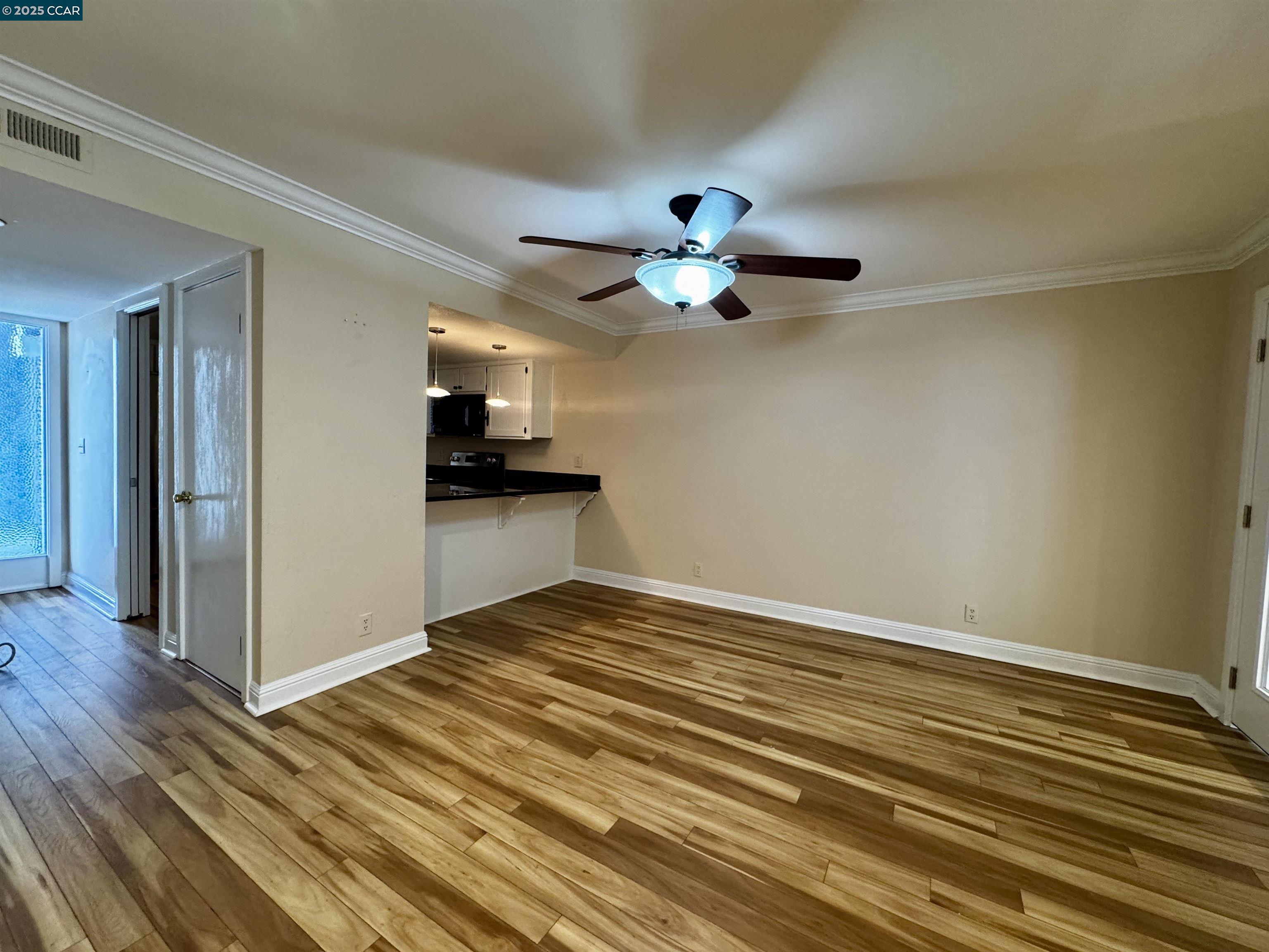 1640 San Miguel Drive Walnut Creek, CA 94596 - Photo 9 of 21 a view of an empty room with wooden floor