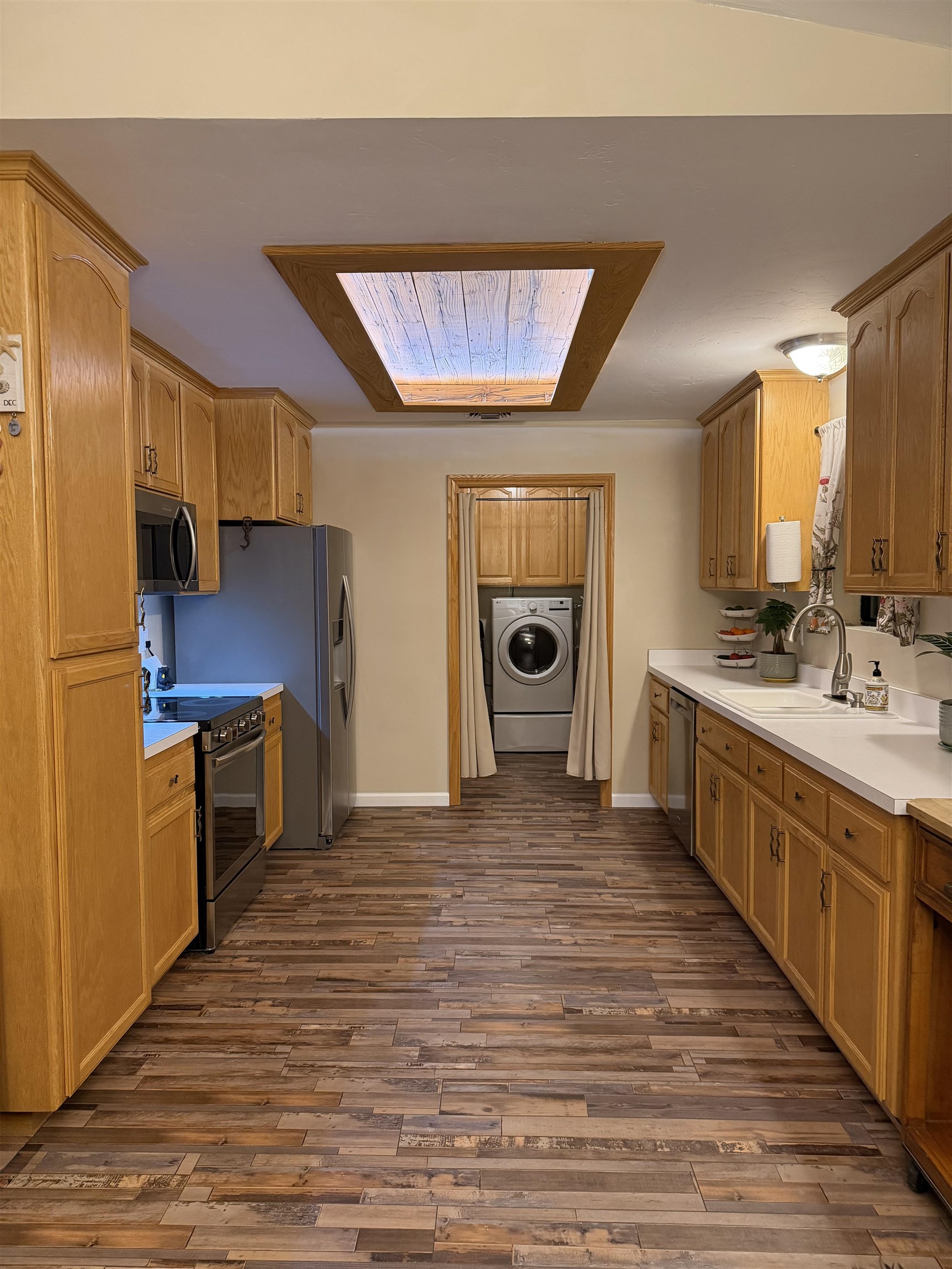 191 Alpine Drive Bishop, CA 93514 - Photo 24 of 50 a kitchen with stainless steel appliances a stove top oven a sink and a refrigerator
