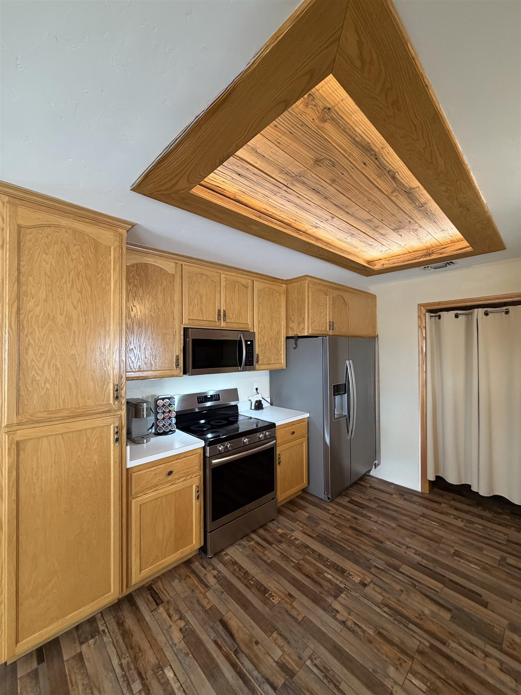 191 Alpine Drive Bishop, CA 93514 - Photo 25 of 50 a kitchen with a refrigerator a stove top oven a sink and dishwasher