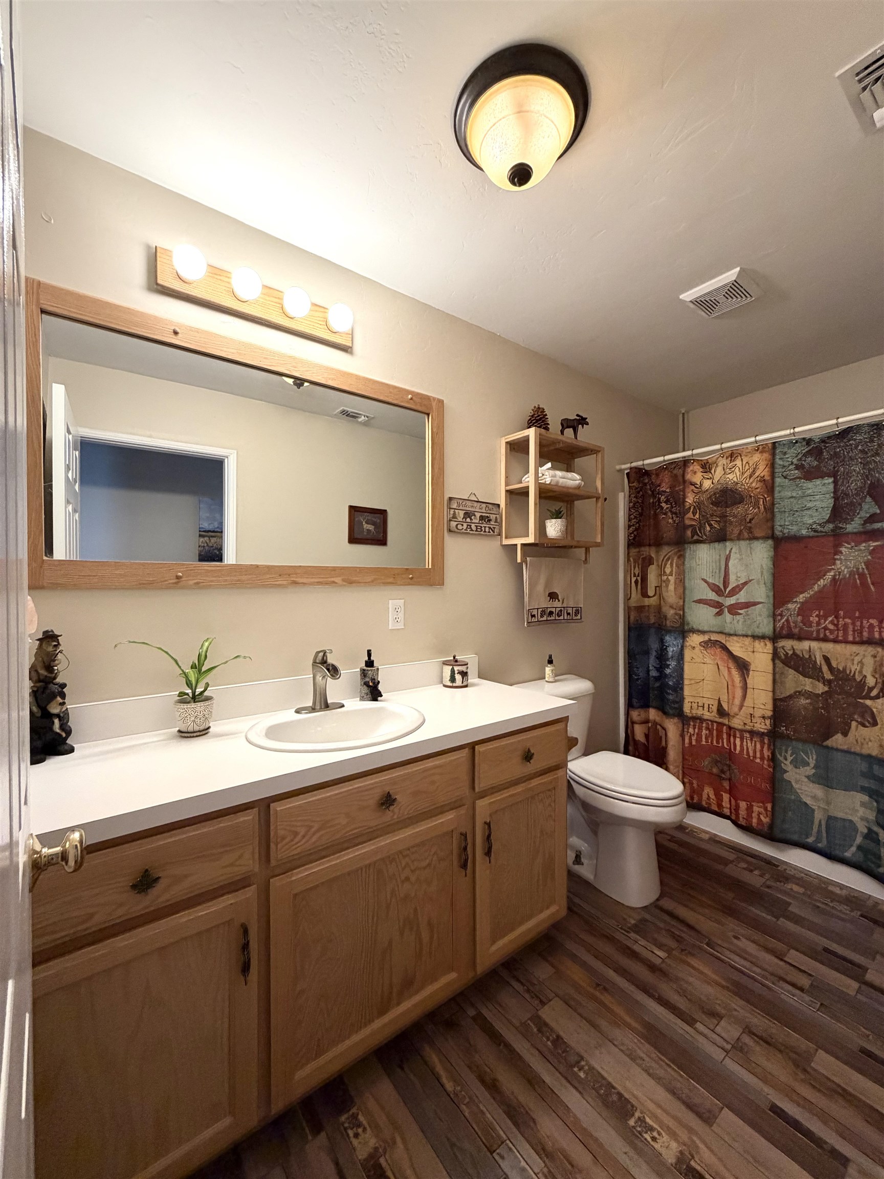 191 Alpine Drive Bishop, CA 93514 - Photo 34 of 50 a bathroom with a toilet sink and mirror