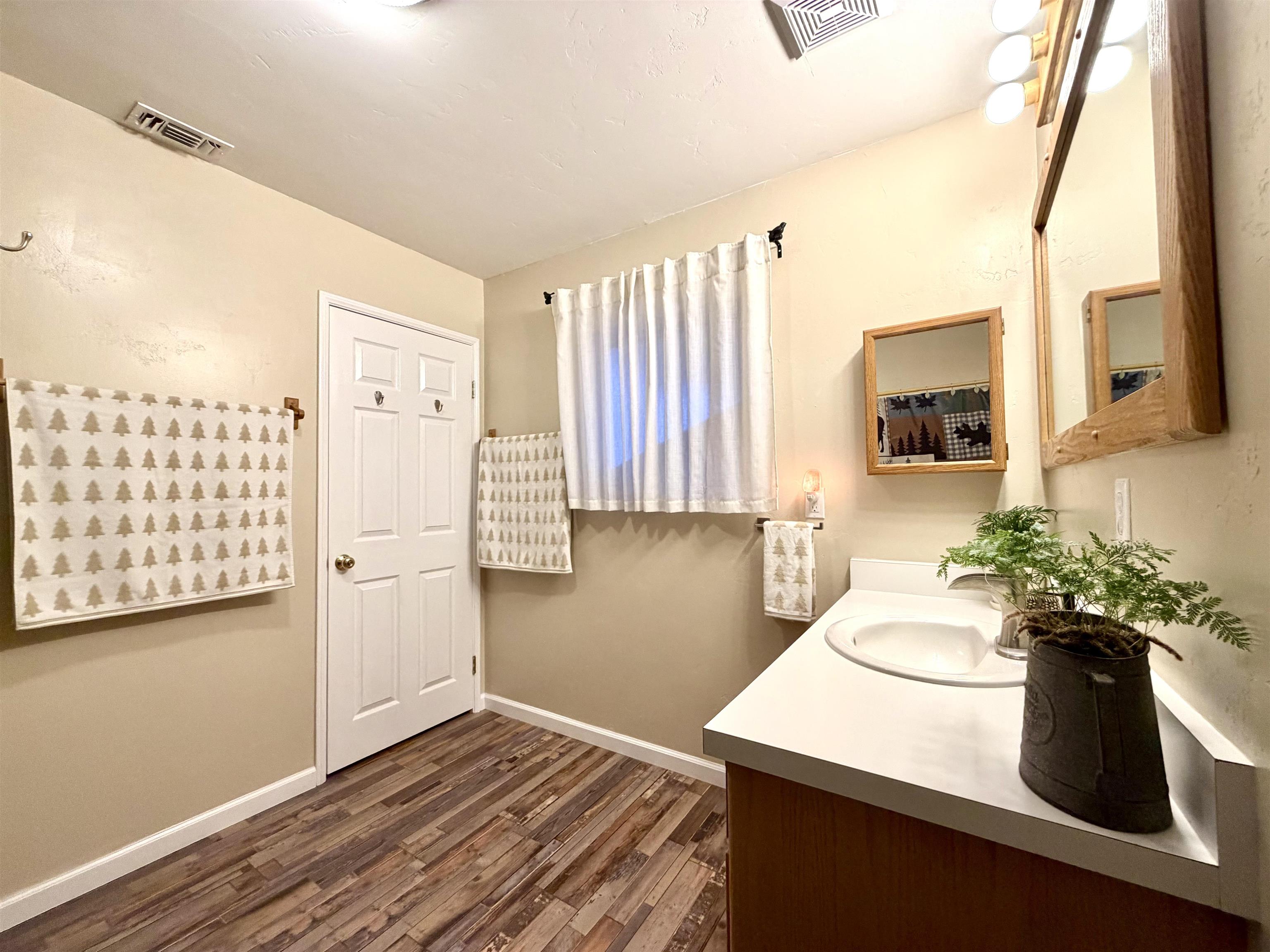 191 Alpine Drive Bishop, CA 93514 - Photo 39 of 50 a view of a room with wooden floor and furniture