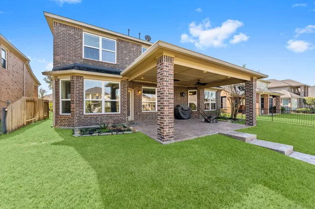 a view of a house with a yard porch and sitting area