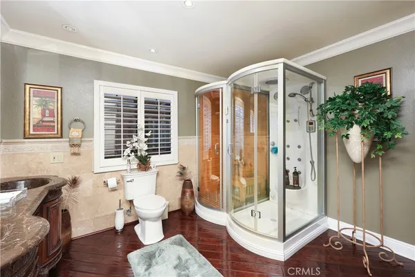 a spacious bathroom with double vanity and a mirror