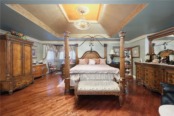 a bathroom with a tub and view of living room