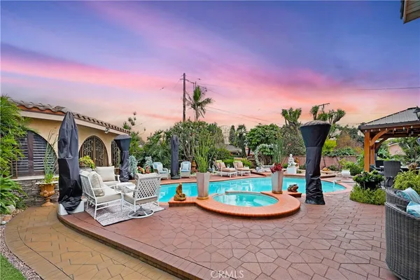 a view of a house with swimming pool